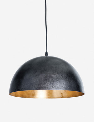 Sigmund black pendant light with a gold-leaf interior by Regina Andrew