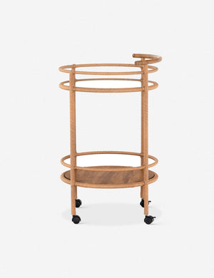 Side profile of the Annika round teak rolling outdoor bar cart.