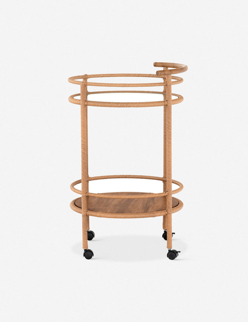 | Side profile of the Annika round teak rolling outdoor bar cart.