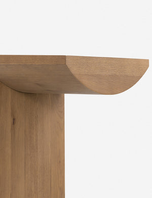 Close up of the leg of the Remwald sculptural oak wood console table.