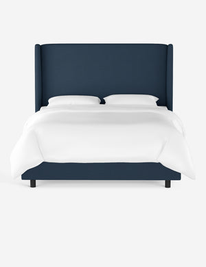 Adara navy linen upholstered bed.