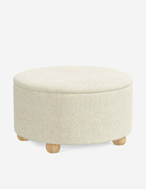 Angled view of the Kamila Cream Performance Basketweave 34-inch ottoman