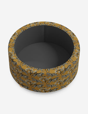 The storage space inside the Kamila tiger golden 34 inch ottoman