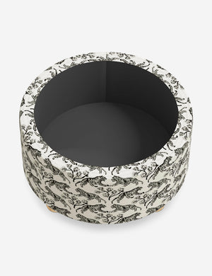 The storage space inside the Kamila Tiger Ivory 34-inch ottoman