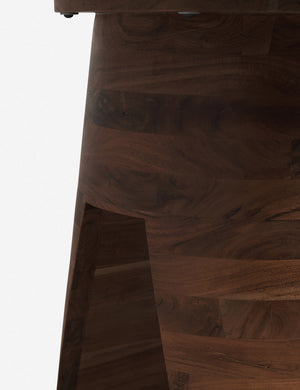 The open arch on the bottom of the Adler acadia wooden round dining table and the acadia slabs