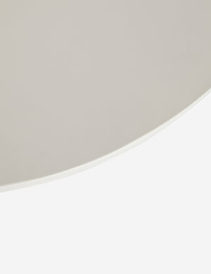 Bird's-eye view of the top of the Anja white indoor and outdoor round coffee table with sculptural legs