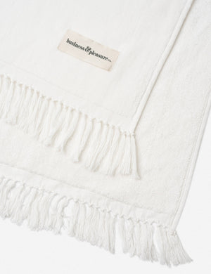 Close-up of the fringed ends on the Antique white Beach Towel by Business & Pleasure Co