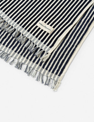 Close-up of the fringed ends on the Navy and white striped Beach Towel by Business & Pleasure Co