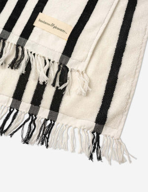 Close-up of the fringed ends on the Black and white striped Beach Towel by Business & Pleasure Co