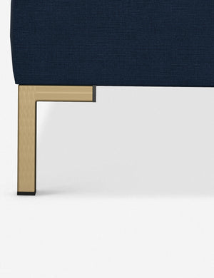 The golden leg on the Deva Navy Linen platform bed