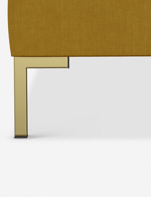 The golden leg on the Deva Citronella Velvet platform bed