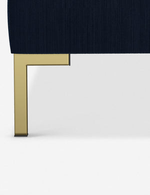 The golden leg on the Deva Navy Velvet platform bed