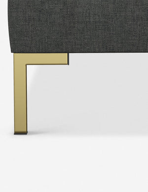 The golden leg on the Deva Charcoal Linen platform bed