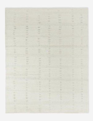 Dolan wool ivory rug with a subtle hashed motif pattern