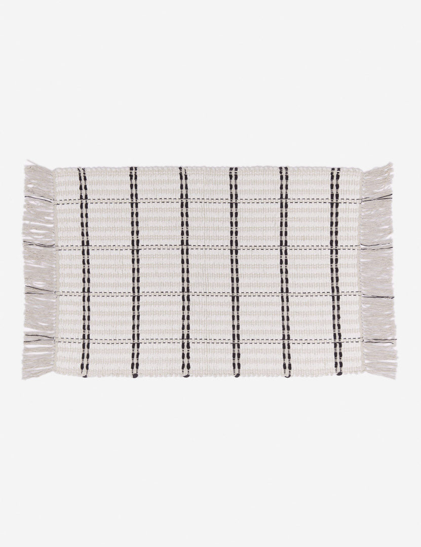 #size::1-9--x-2-10- #size::2--x-5- | Elin cotton mat featuring a thick fringe and black and white stripes