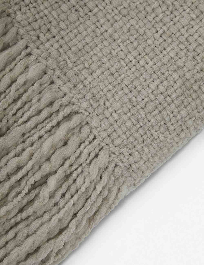 | Close-up of the wool knit details and tasseled ends on the Goleta gray chunky throw blanket