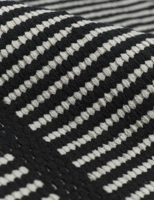 Close-up of the Ines handwoven black-and-white striped mat