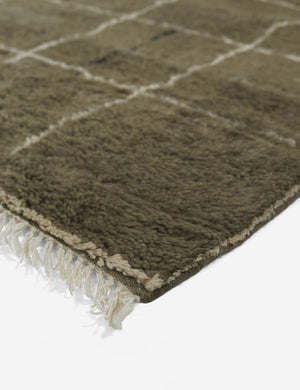 Tasseled ends on the Khaki green Irregular Grid Rug by Sarah Sherman Samuel