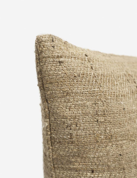 | Corner shot of the Jonas natural-toned Silk Pillow