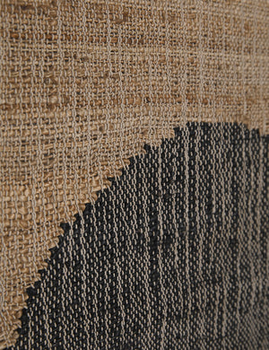 Close-up of the flat weave fabric on the Katlee black and natural flat weave Wall Hanging