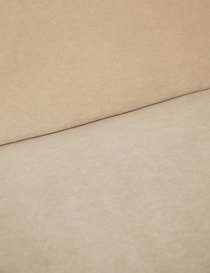 Where the back and seat of the Lena armless brie beige velvet sofa meet