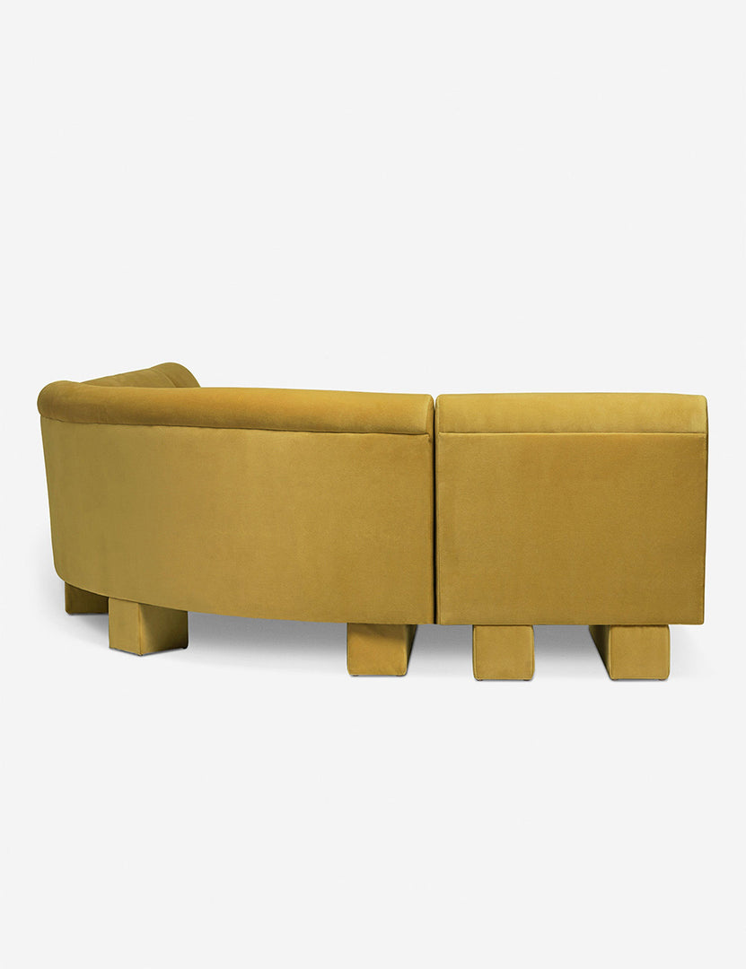 #color::Goldenrod-velvet #configuration::left-facing #size::142-W | Rear view of the side of the Lena left-facing yellow velvet sectional sofa with upholstered beam legs.