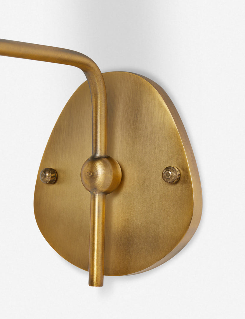 #color::black-trim #finish::brass | Close up of the wall mount of the Magdalene brass single sconce