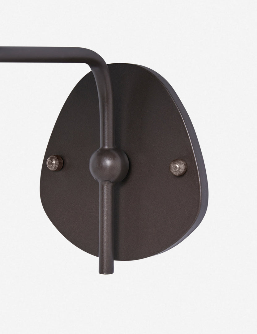 #color::black-trim #finish::bronze | Close up of the wall mount of the Magdalene black single sconce