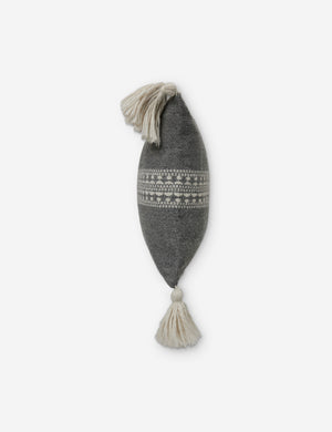 Side view of the Marchesa agate gray indoor and outdoor lumbar pillow with tasseled corners