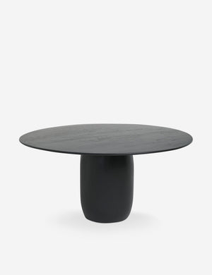 Maroko black round dining table with a tapered pedestal base