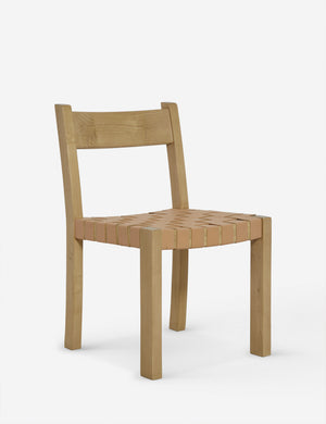 Angled view of the Vix light wood frame and woven leather seat dining chair.