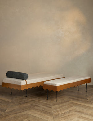 The Rise Daybed sits in a studio room with the Rise Bench