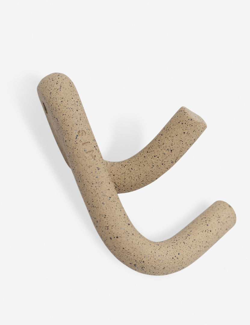 #color::speckled | Angled view of the Cream speckled Leggy Crossed Wall Hook by SIN Ceramics