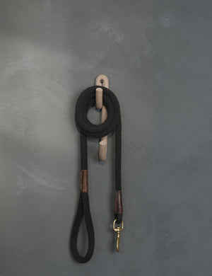 Cream speckled Leggy Long Wall Hook by SIN Ceramics with a leash hanging on it