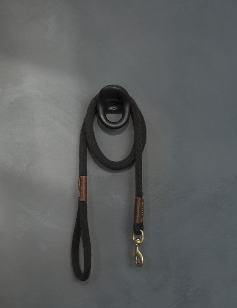 #color::black | The olo black wall hook with a black leash hanging from it