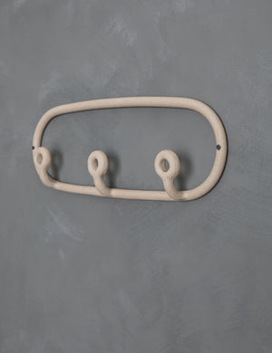 Angled view of the Cream speckled Trio Stoneware Coat Rack by SIN Ceramics