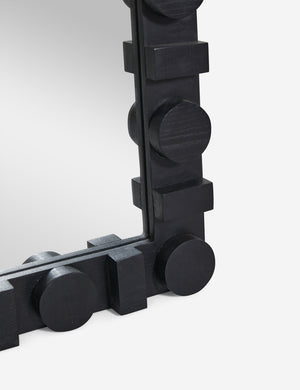 Close up of the bottom corner of the Sorenson Floor Mirror in black