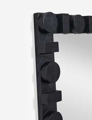 Close up of the top corner of the Sorenson Floor Mirror in black.