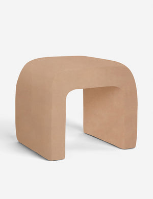 Angled view of the Tate buff pink velvet stool