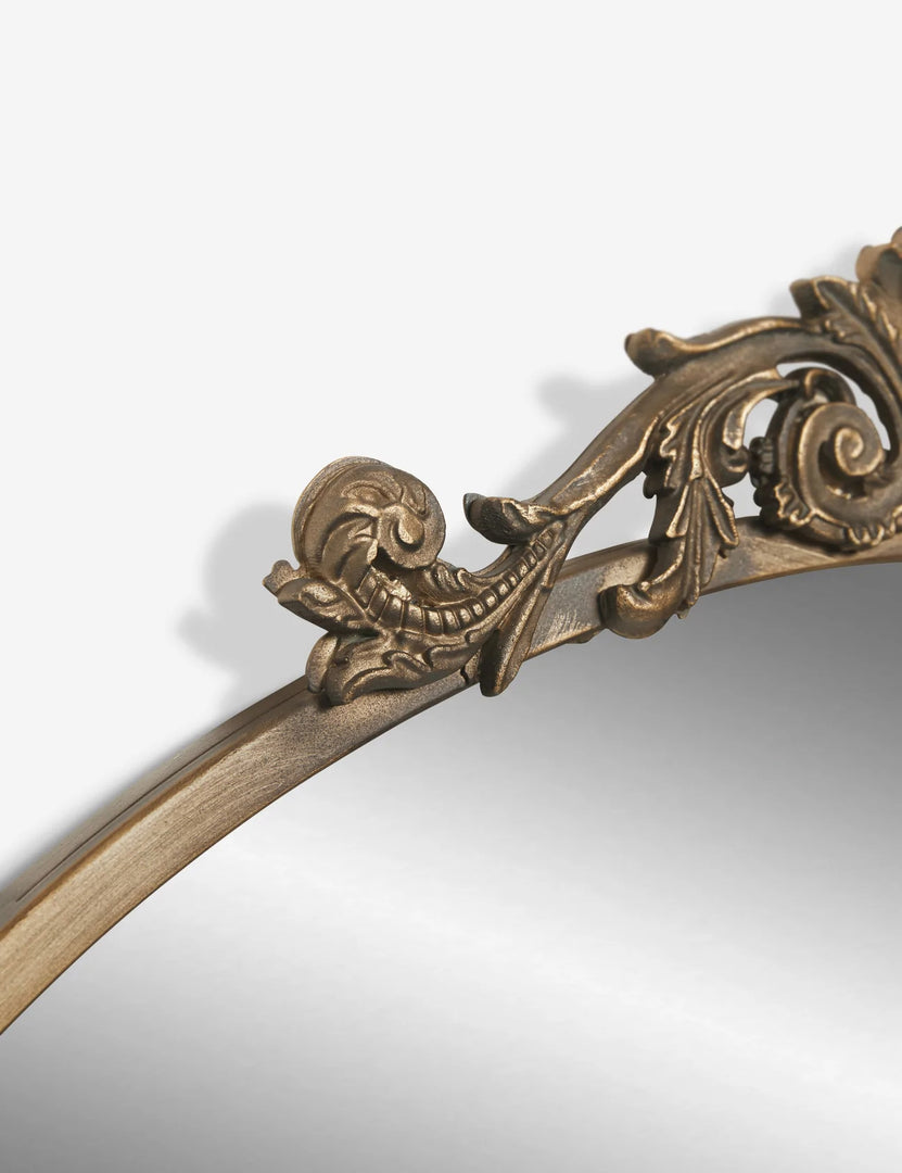 #color::gold | The traditional scroll detailing on the tulca gold round mirror