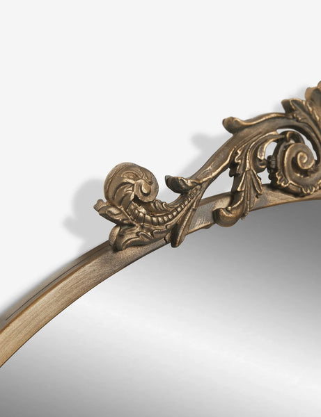 #color::gold | The traditional scroll detailing on the tulca gold round mirror