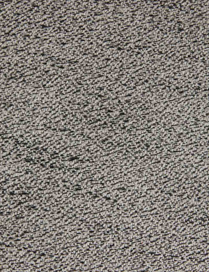 Detailed view of the gray cushioning on the Whit honey wood sculptural dining chair by sarah sherman samuel