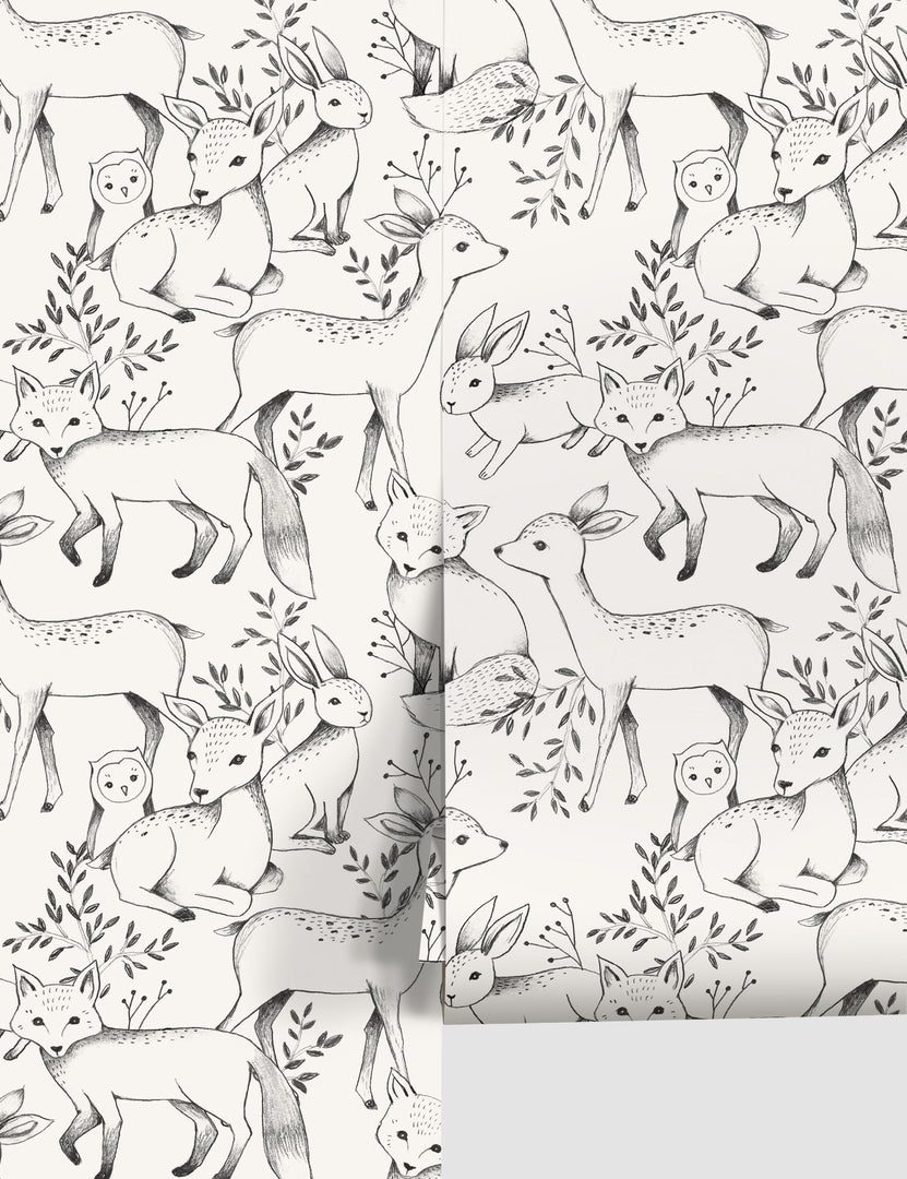 | Ivory Woodland Wallpaper with black deer, fox, owl, and rabbit designs by Rylee + Cru