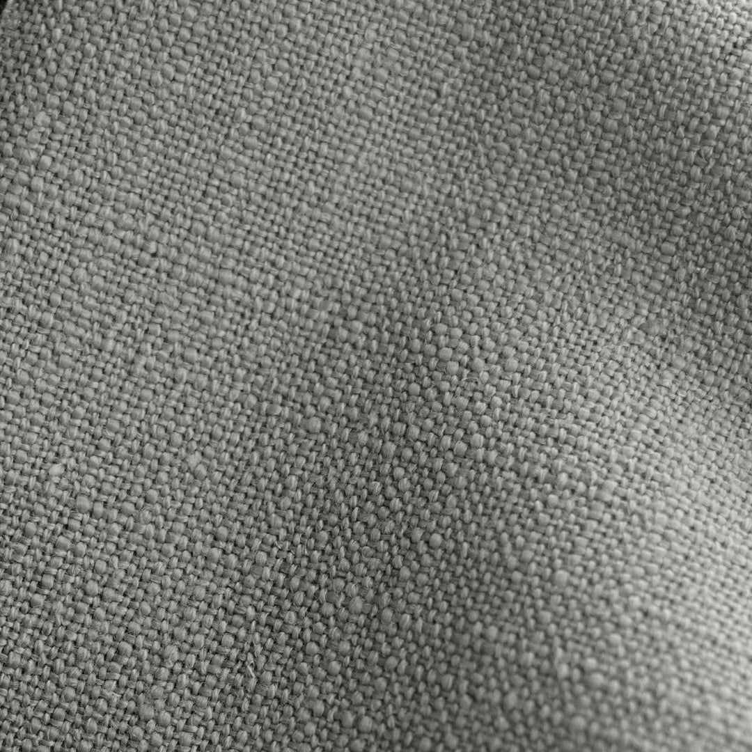 #color::gray #size::cal-king #size::full #size::king #size::queen #size::twin | Detailed shot of the gray linen on the Adara gray linen upholstered bed.