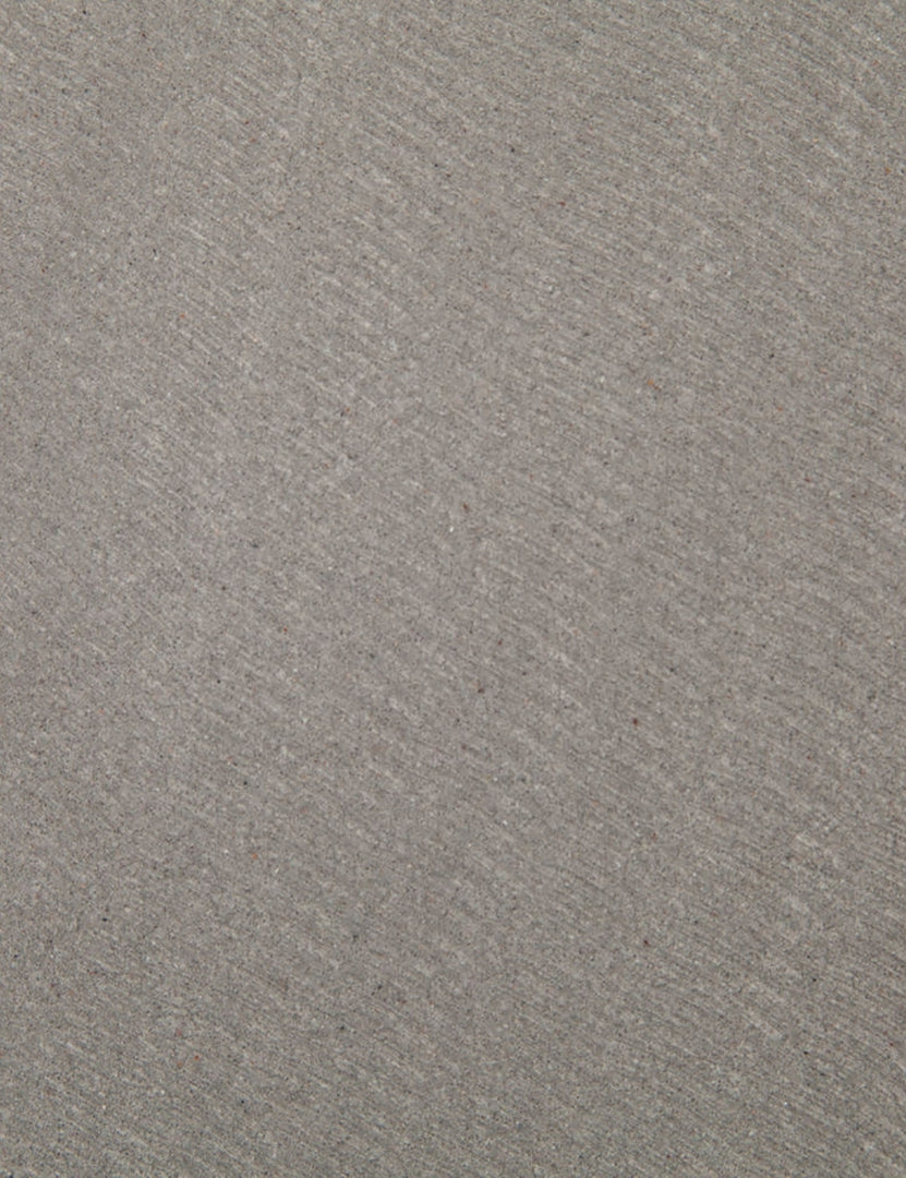 | Detailed view of the lavastone material on the surface of the Agatha indoor and outdoor dining table with black iron base