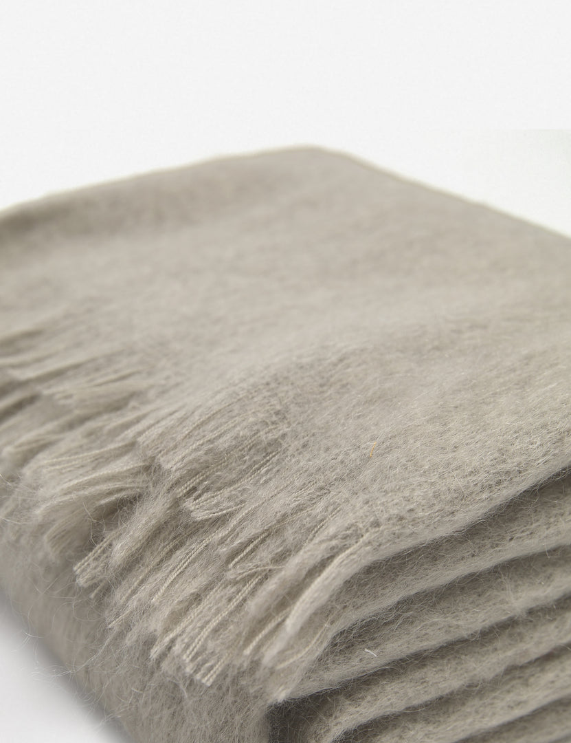 #color::warm-gray | Close-up of the Aimee mohair warm gray wool throw blanket with fringe ends