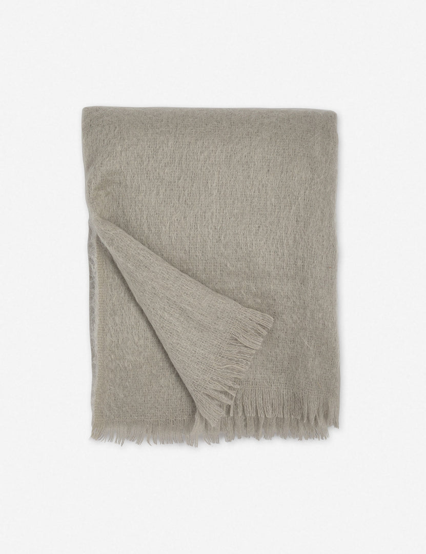 #color::warm-gray | Aimee mohair warm gray wool throw blanket with fringe ends with the corner folded in