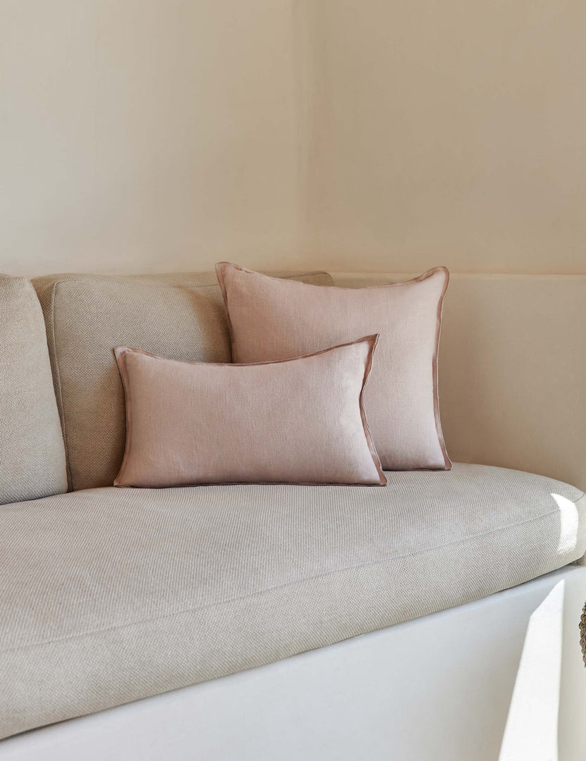 #color::greige #style::lumbar #fill type::with-feather-down-insert #fill type::pillow-cover-only | The arlo Greige flax linen pillow in its lumber and square sizes sit together on a natural linen sofa