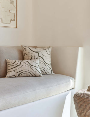 Canyon Olive Green Lumbar and Square Pillows sit on a cushioned white bench
