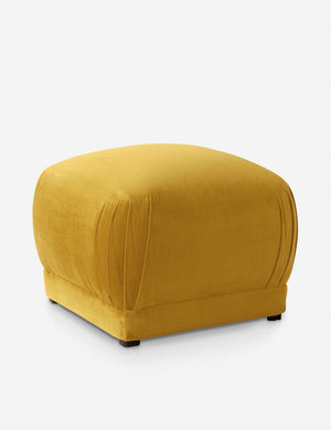Angled view of the Bailee citronella velvet ottoman